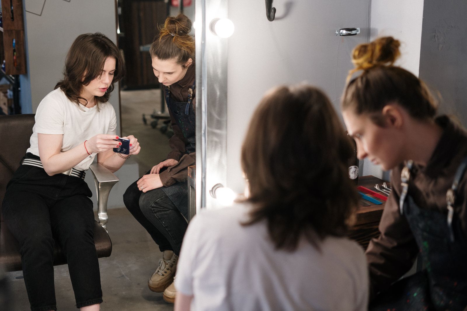 Stylist and client discussing a hairstyle together