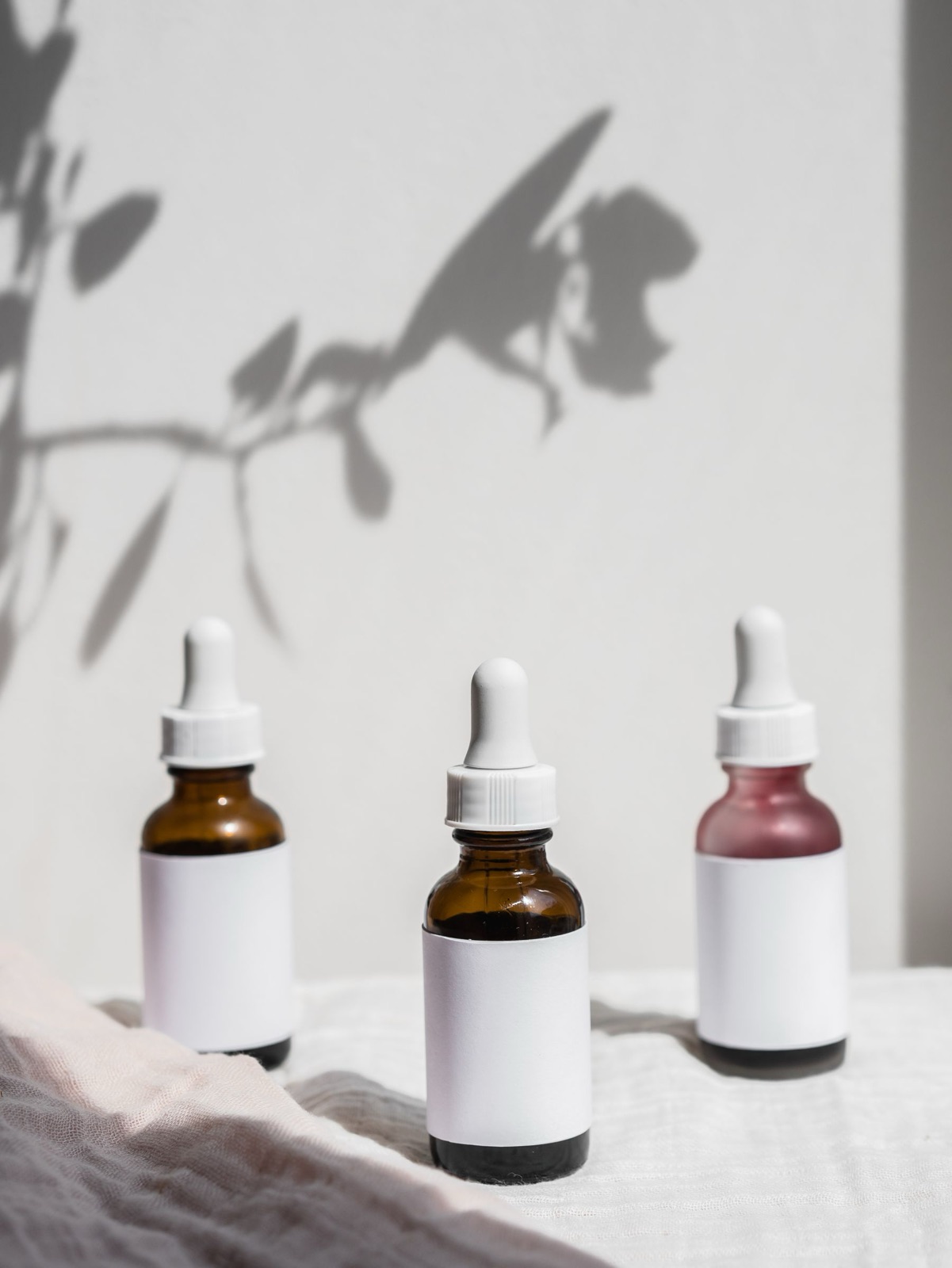 Unbranded botanical bottles in soft natural light